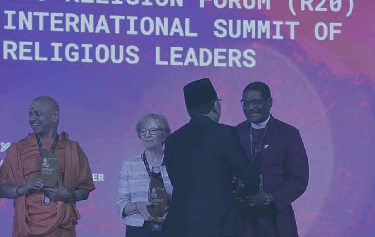 Swami Govinda Dev Giri Maharaj, Dr. Valeria Martano, and Archbishop Henry Ndukuba, are greeted by R20 founder Yahya Cholil Staquf.