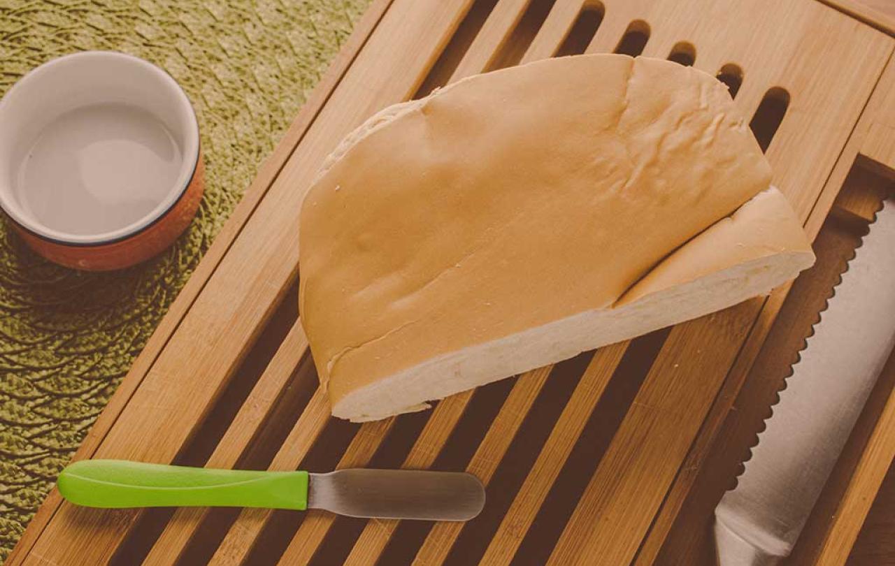 bread a piece of cutlery rest on a breadboard
