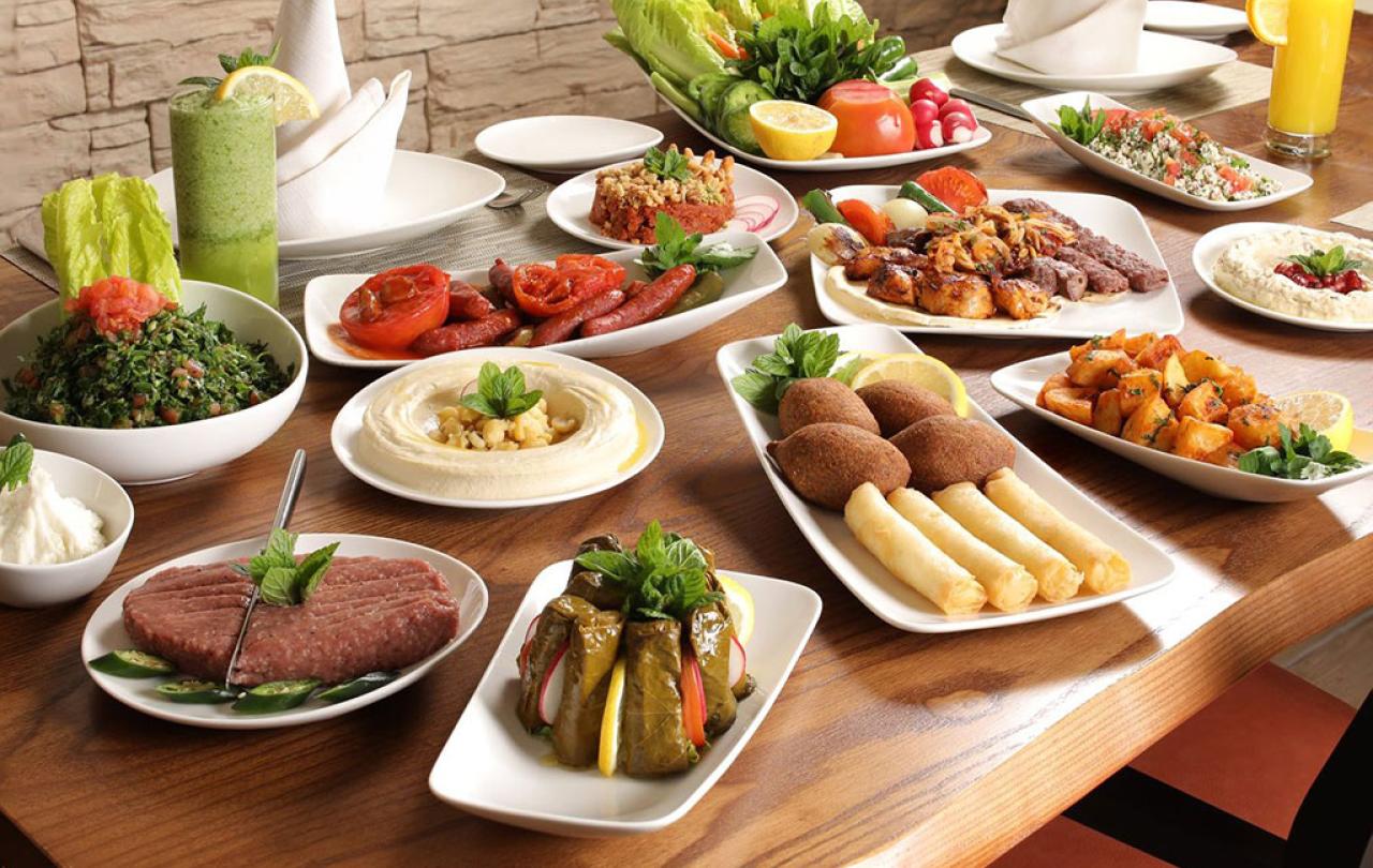 a Lebanese meal of many dishes displayed on a table.