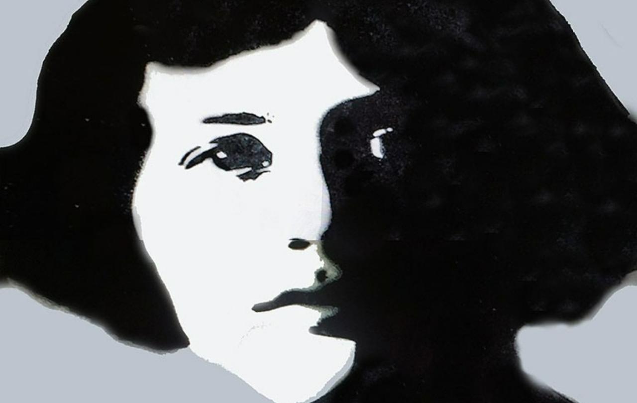 A monotone street mural of a young woman looking fiercely at the viewer.