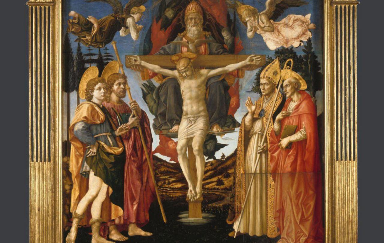 A painted altarpiece depicts a crucified Christ surrounded by followes, angels and soldiers.