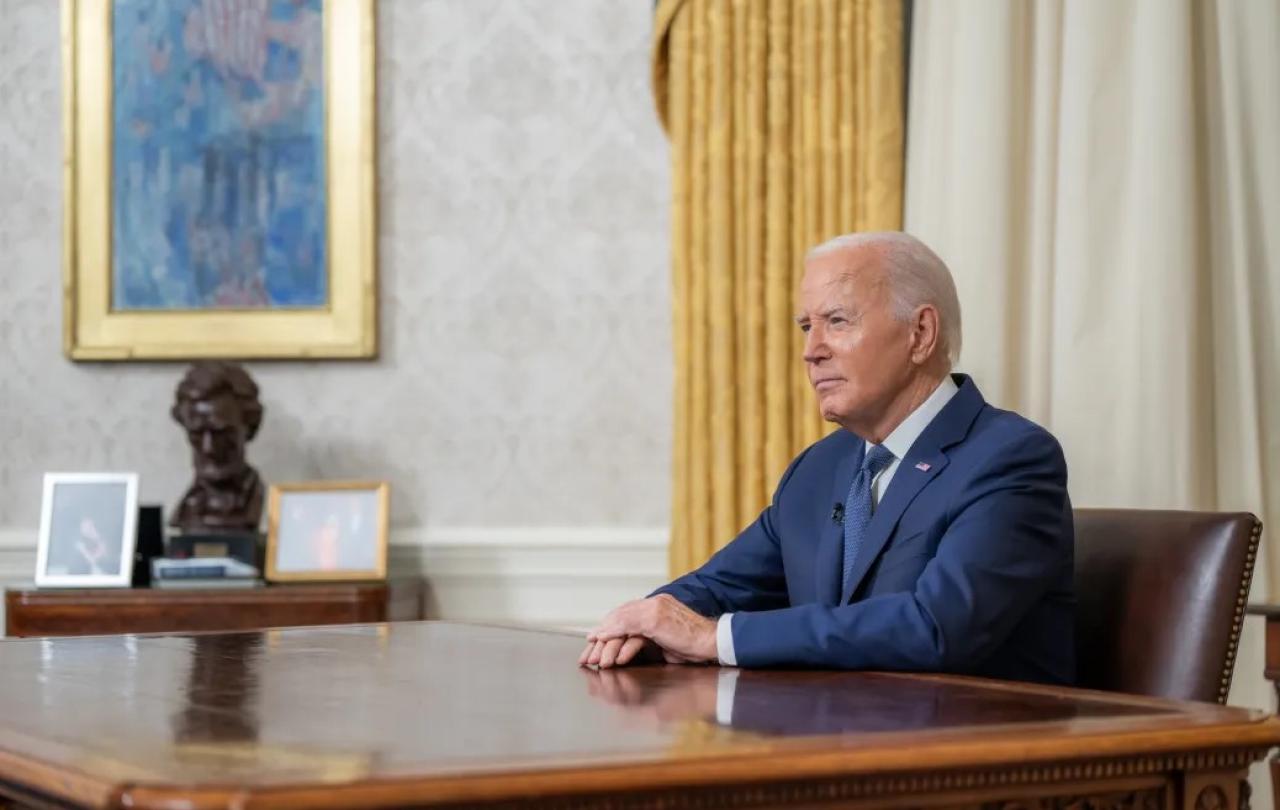 President Biden, at his desk after announcing his decision.