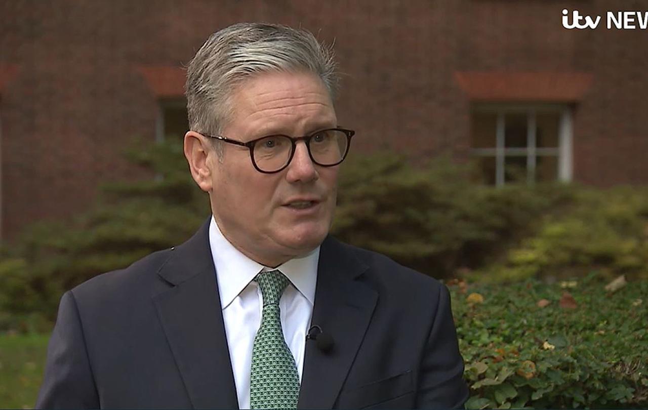 A smartly dressed politician talks while being interviewed