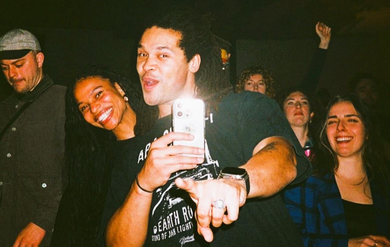Ravers pose together for a selfie.