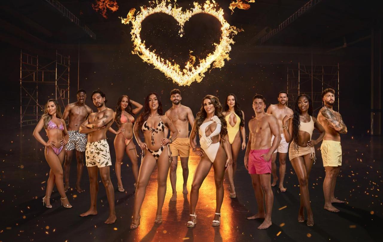A Composite image of Love Island contestants stand together in a group under a fiery heart.