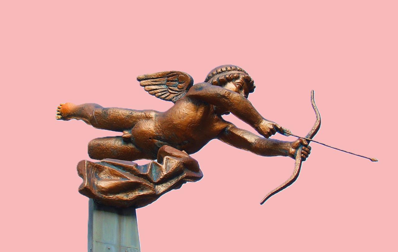 A cupid statue fires an arrow of love.