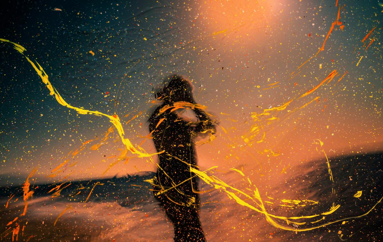 A collage image shows a person holding their head, with a wash of warm colours over the scene.