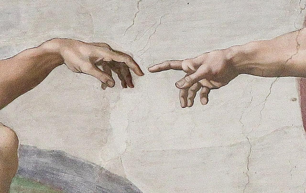 Painting of hand of God touching hand of Adam.