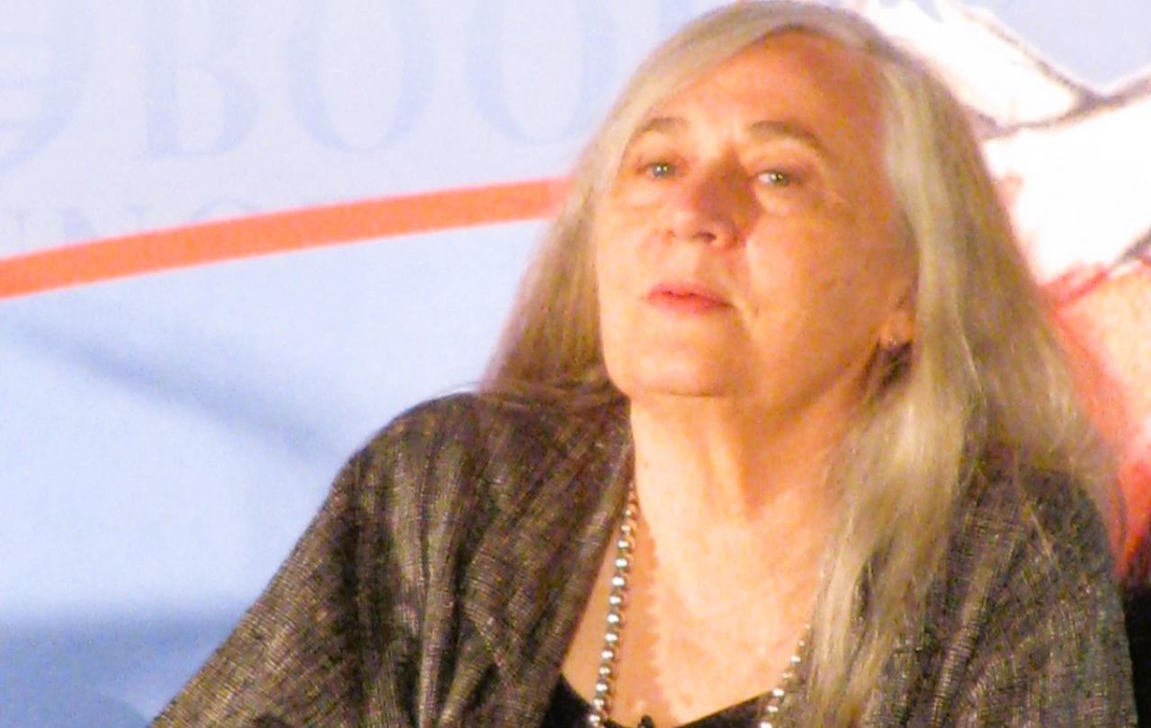 An author sits and listens.