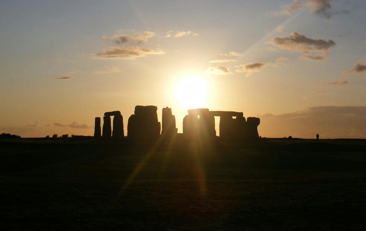 Sun rise casts a shadow over Stonehenge.