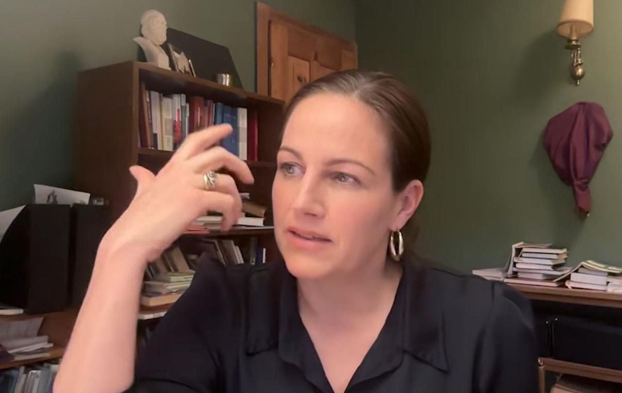A podcast guest gestures with her hand.