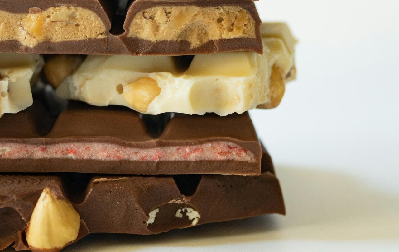 Broken bars of chocolate piled upon each other.