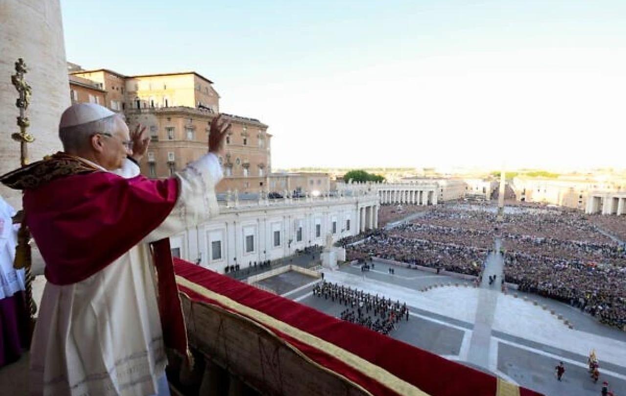 Pope Leo waves to the crowd.