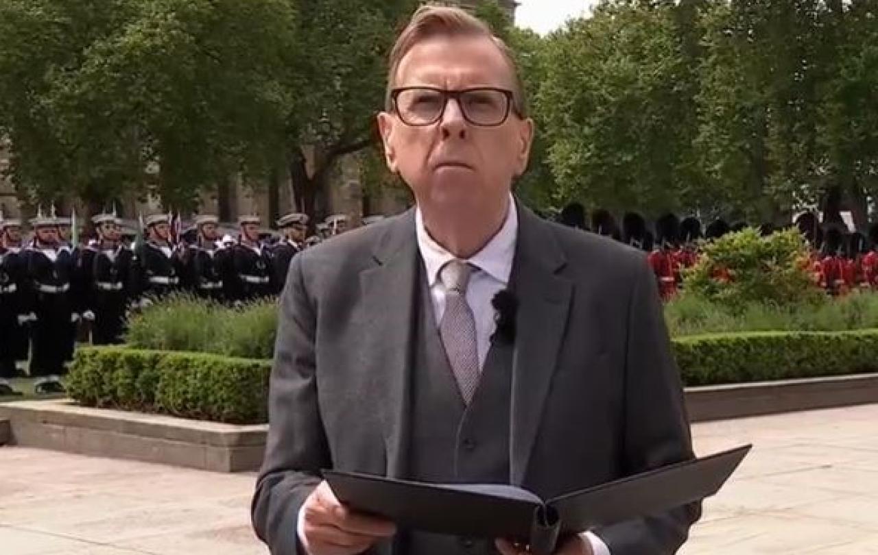 An actor reads a speech at a commemoration