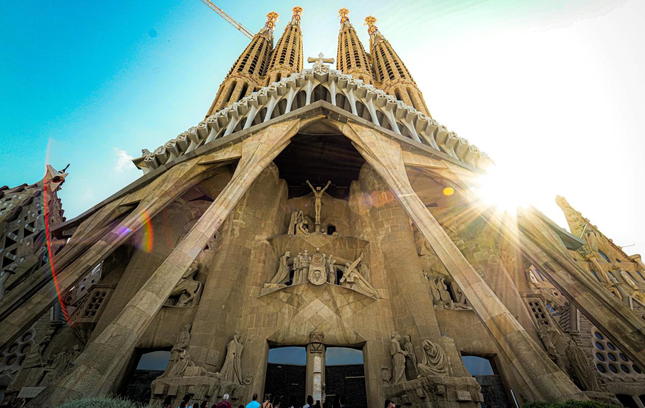 Looking up at the front of Gaudi's cathedra; as the sun comes out from behind the spires.