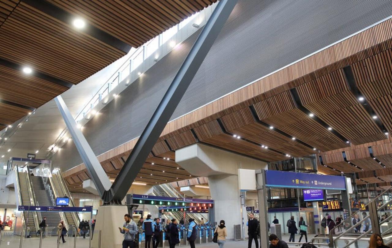 A station concourse with a light well above.