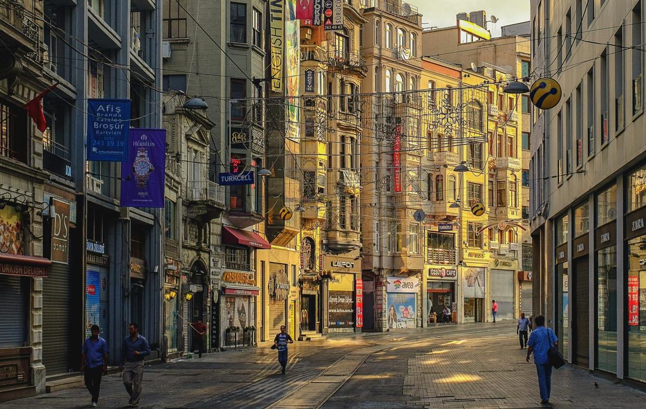 An Istanbul street curves and the sun illuminates one side