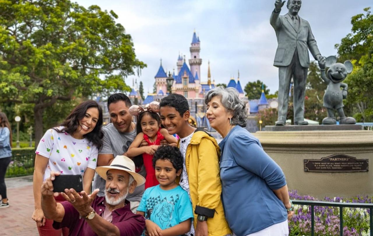A family pose for a picture at Disneyland