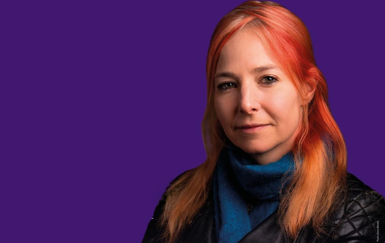 A head and shoulder image of Alice Roberts against a purple background