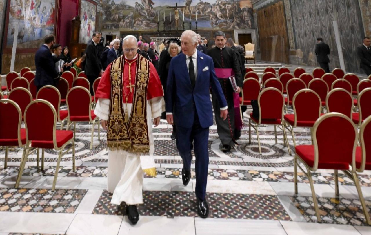 The Pope and King Charles walk together from the Sistine Chapel