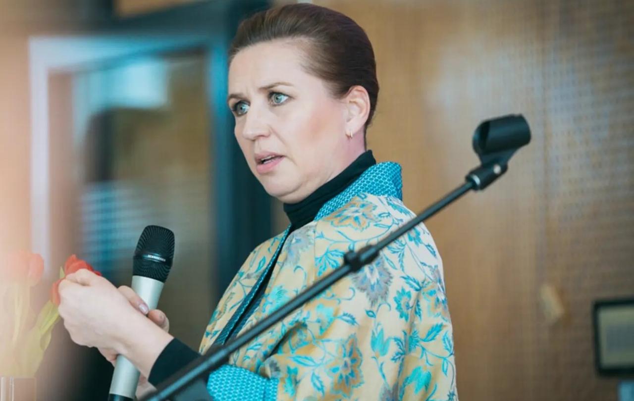 Mette Frederiksen gesture as she delivers a speech. 
