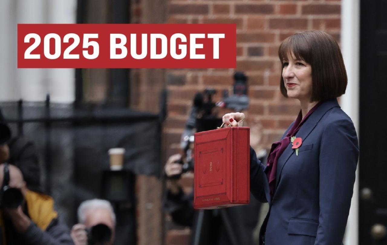 Rachel Reeves holds a red briefcase up.