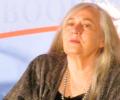 An author sits and listens.