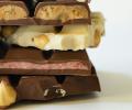 Broken bars of chocolate piled upon each other.