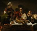 A painting depicts Jesus talking to disciples at a meal.