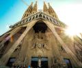 Looking up at the front of Gaudi's cathedra; as the sun comes out from behind the spires.
