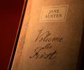 A book cover with a handwritten title that reads: Jane Austen volume the first