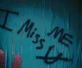 Graffiti reads 'I miss me' with u crossed out under the 'mem'