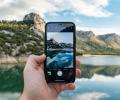 A phone shows a picture of the real view behind it. 