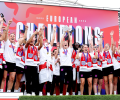 A victorious women's football team celeberate.
