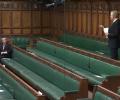 A backbench MP stands in an almost empty chamber and speaks