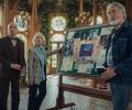 Elderly amateur sleuth stand by their pinboard.