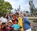 A family pose for a picture at Disneyland