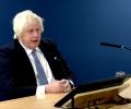 Boris Johnson sits, giving evidence to an inquiry.