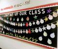 A classroom display of Christmas baubles under a banner.