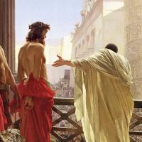 A balcony scene viewed behind shows a Roman ruler leaning over a balcony to the crowd while gesturing to a semi-naked Christ.