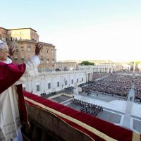 Pope Leo waves to the crowd.