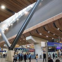 A station concourse with a light well above.