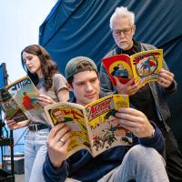 A film crew read old comics on set.