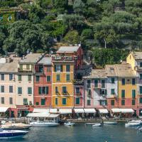 A colourful row of buildings in an Italian port.
