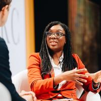 Kemi Badenoch sits and talks.