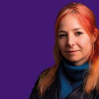 A head and shoulder image of Alice Roberts against a purple background