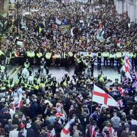 CCTV footage show two rival protests divided by a line of riot police.