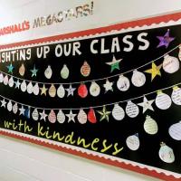 A classroom display of Christmas baubles under a banner.
